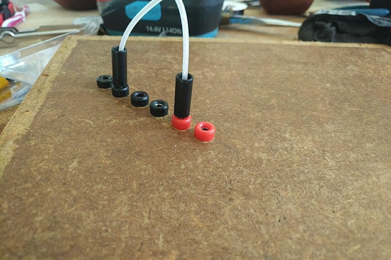 I started prototyping with a thin MDF board and some DIY cables.